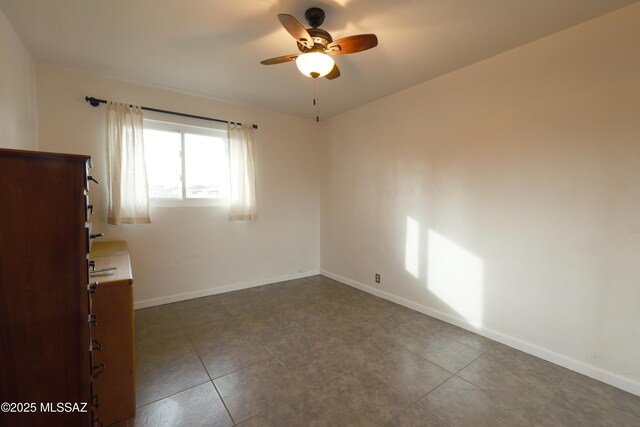 spare room with ceiling fan