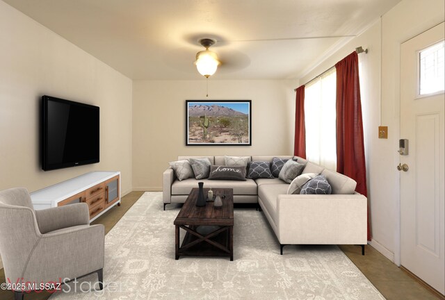 tiled living room with ceiling fan