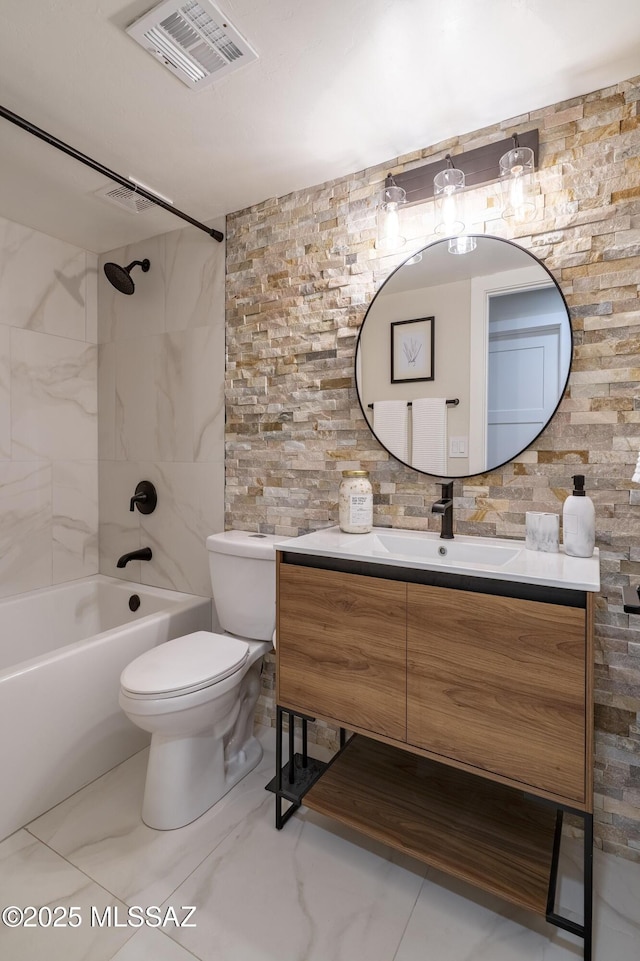 full bath with visible vents, toilet, vanity, shower / bathtub combination, and marble finish floor