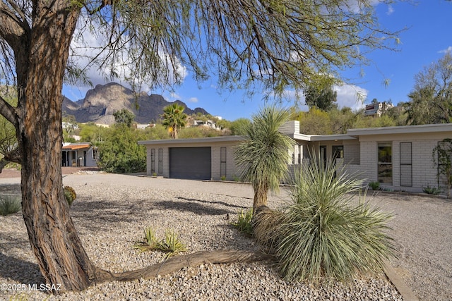 view of front of house with a mountain view and brick siding