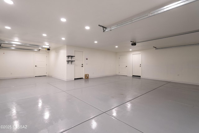 garage with a garage door opener, baseboards, and recessed lighting