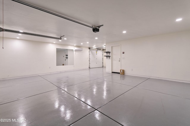 garage with recessed lighting, a wall mounted AC, and a garage door opener