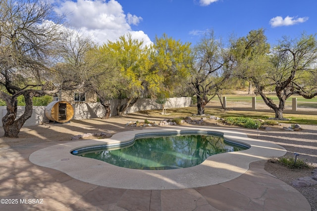 view of swimming pool with a fenced in pool and a fenced backyard