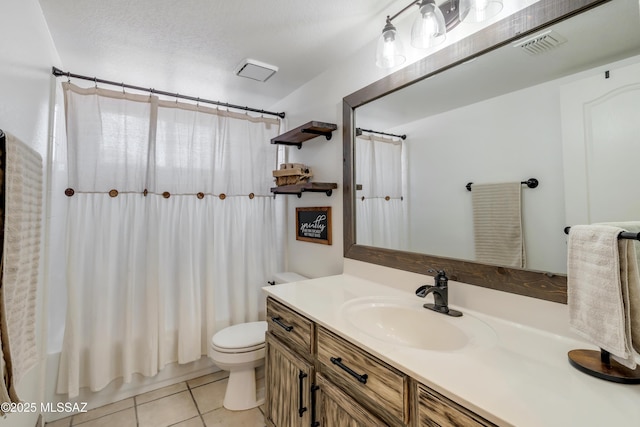 full bathroom with toilet, vanity, tile patterned floors, shower / bath combo with shower curtain, and a textured ceiling