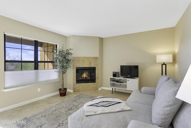 tiled living room with a tile fireplace