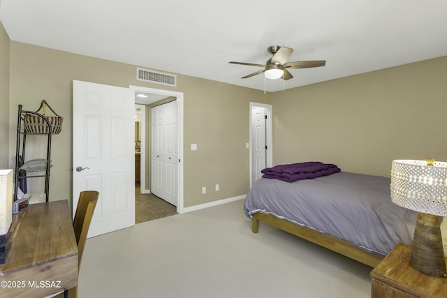 carpeted bedroom featuring a closet and ceiling fan