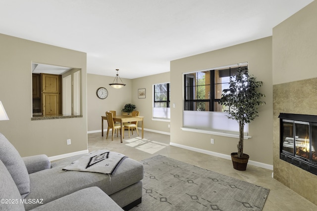 tiled living room featuring a tiled fireplace