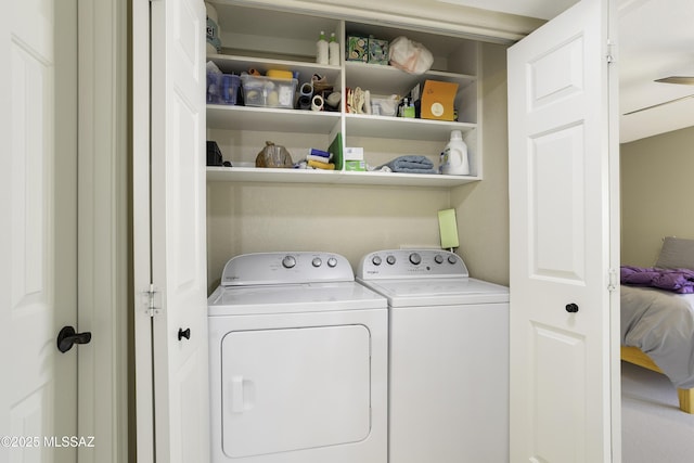 laundry room featuring washing machine and clothes dryer