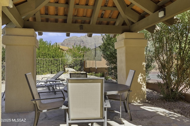 view of patio with a mountain view and a gazebo