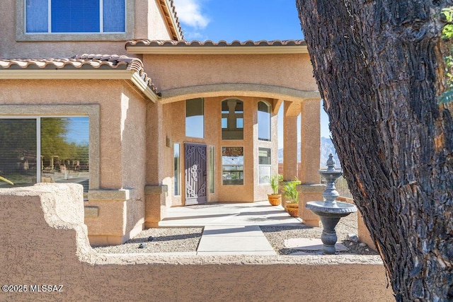 doorway to property featuring a patio