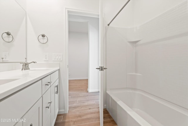 bathroom with vanity and bathtub / shower combination