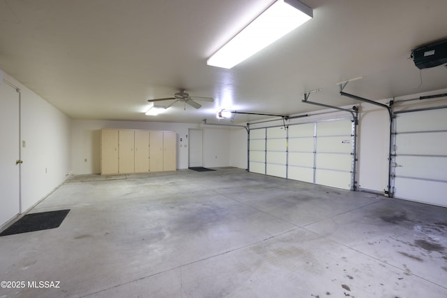 garage featuring ceiling fan and a garage door opener