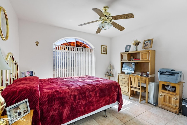 tiled bedroom with ceiling fan