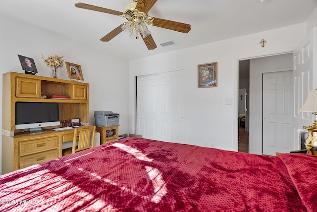 bedroom with ceiling fan and a closet