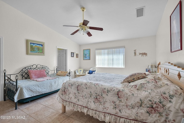 tiled bedroom with a ceiling fan, visible vents, and vaulted ceiling