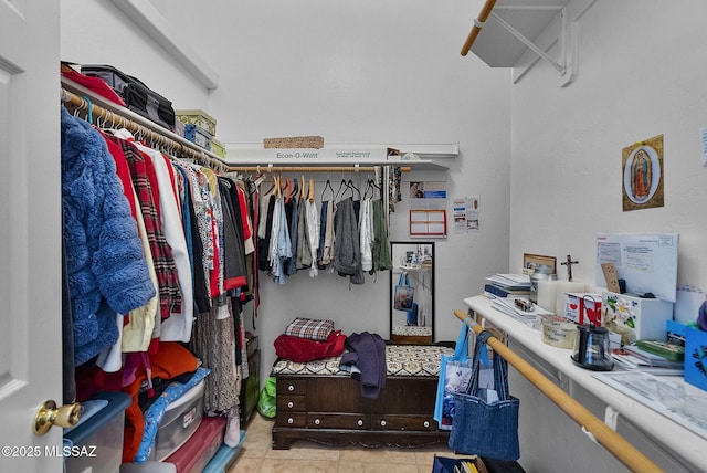 spacious closet with light tile patterned flooring