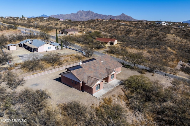 drone / aerial view featuring a mountain view