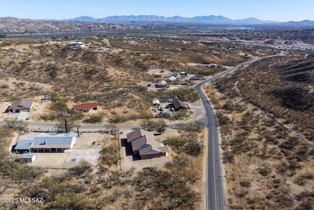 birds eye view of property with a mountain view