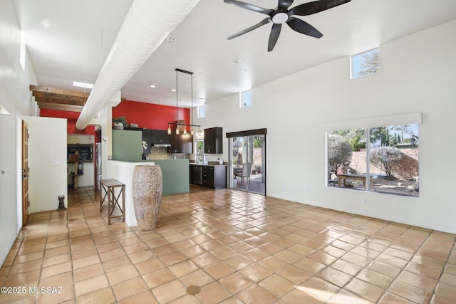 living room featuring light tile patterned flooring and ceiling fan