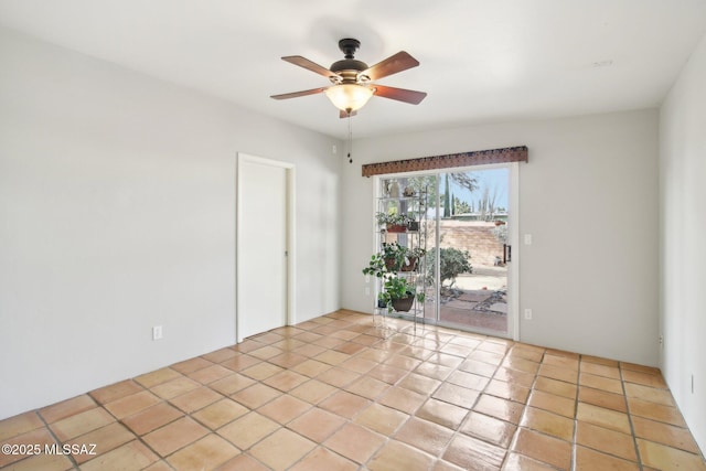 unfurnished room with light tile patterned flooring and ceiling fan