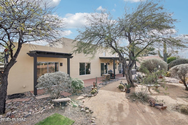 back of property featuring a patio area