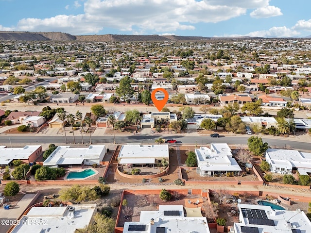 birds eye view of property with a mountain view