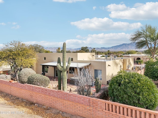 back of property featuring a mountain view