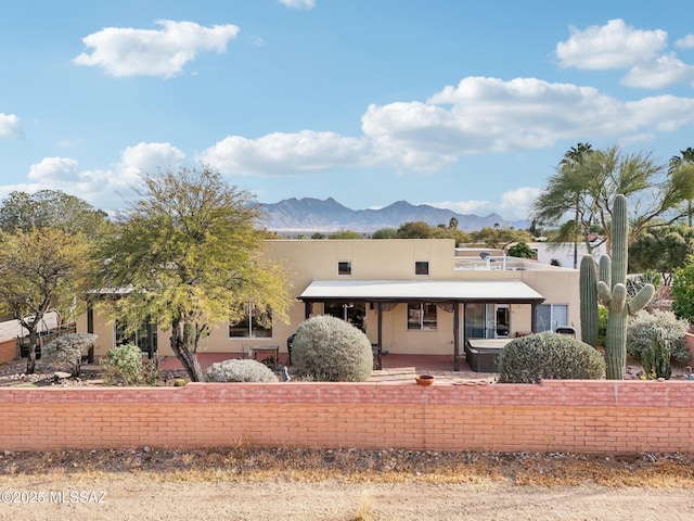 view of front facade featuring a mountain view