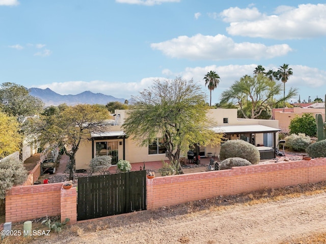 view of front of home featuring a mountain view