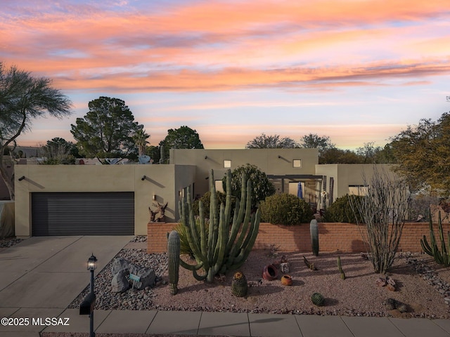 adobe home featuring a garage