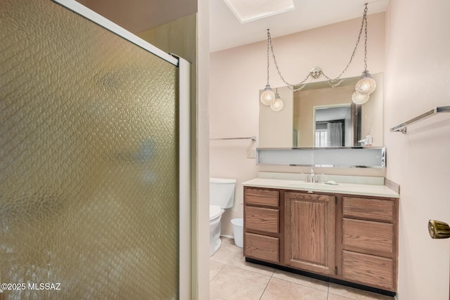 bathroom with toilet, an enclosed shower, vanity, and tile patterned floors