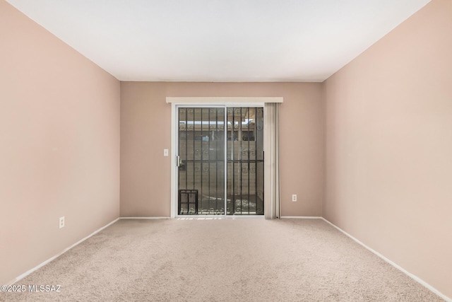 unfurnished room with carpet flooring