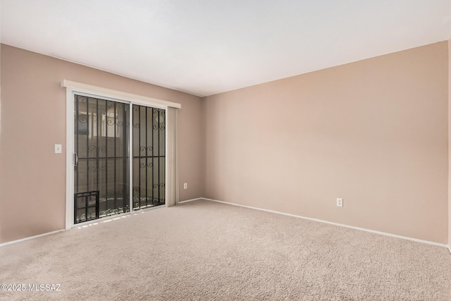 unfurnished room featuring carpet floors