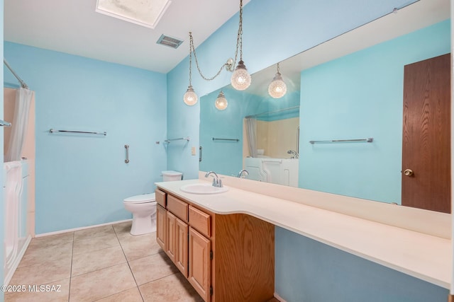 bathroom with toilet, vanity, tile patterned floors, and a shower with curtain