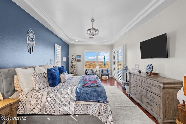 bedroom with ornamental molding, access to exterior, and dark wood-style flooring