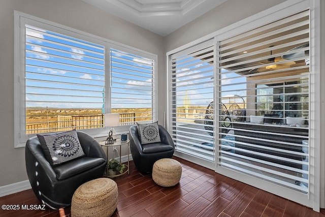 sitting room with wood tiled floor and baseboards