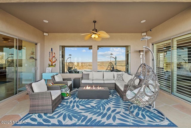 view of patio with outdoor lounge area and ceiling fan