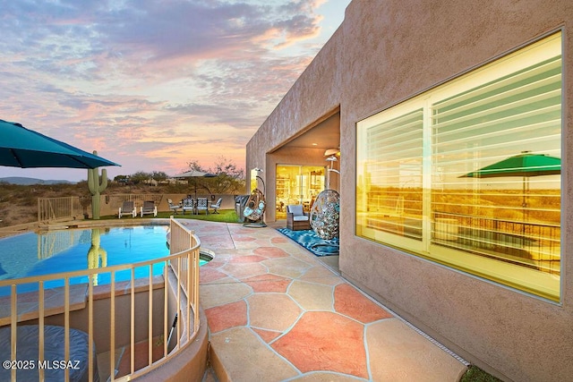 view of swimming pool featuring a fenced in pool and a patio