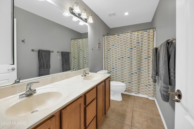 bathroom with toilet, vanity, tile patterned floors, and a shower with shower curtain