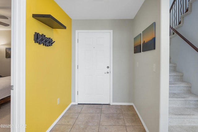 doorway to outside featuring light tile patterned floors