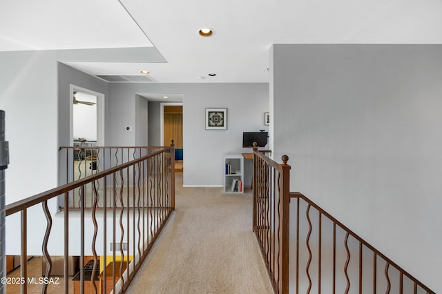 hallway featuring light carpet