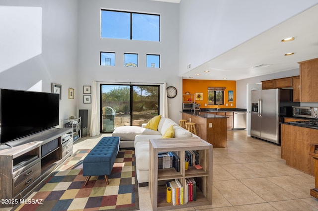 tiled living room with a high ceiling