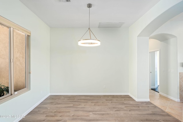 spare room with light wood-type flooring