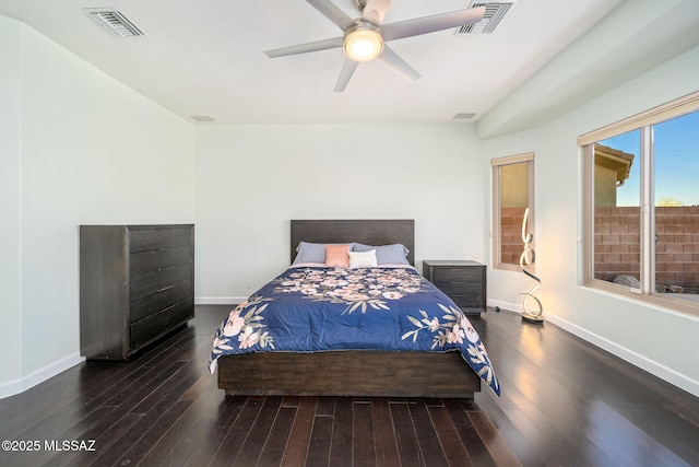 bedroom with dark wood-type flooring and ceiling fan