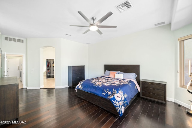 bedroom with ceiling fan and dark hardwood / wood-style flooring