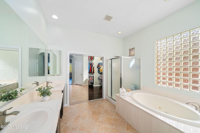 bathroom featuring tile patterned floors, vanity, and separate shower and tub