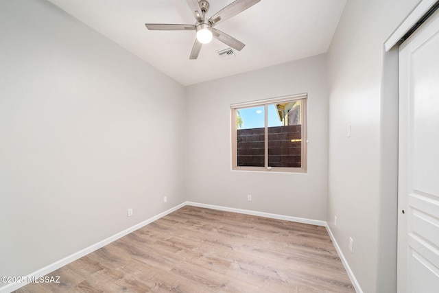 spare room featuring ceiling fan and light hardwood / wood-style floors