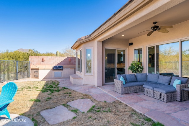 view of patio with ceiling fan, grilling area, and area for grilling