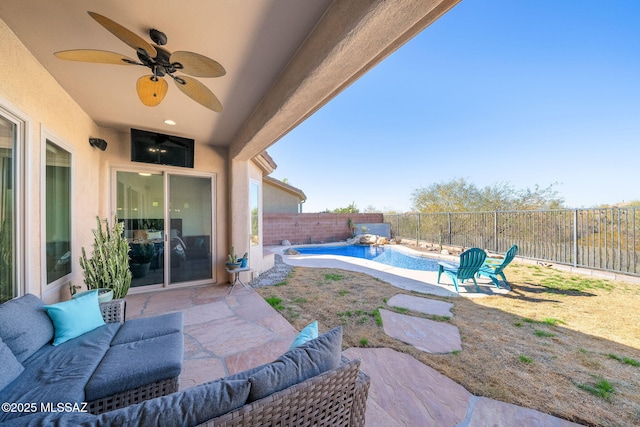 view of patio / terrace featuring a fenced in pool, an outdoor living space, and ceiling fan