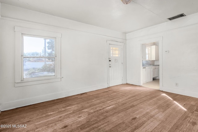 unfurnished room featuring hardwood / wood-style floors